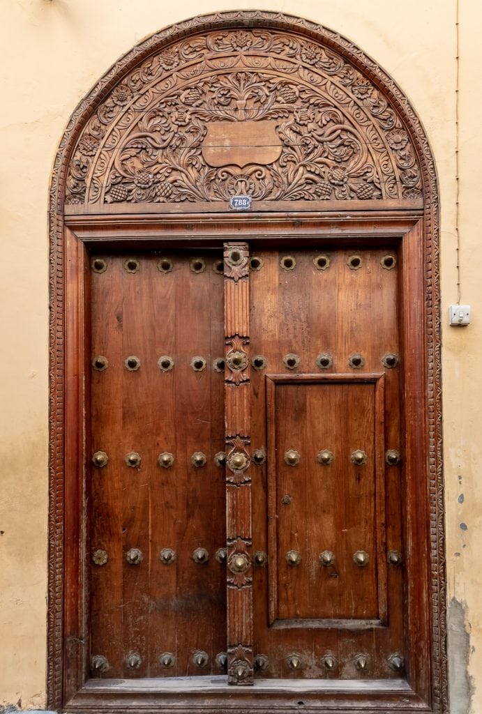 Famous carved wooden doors with brass studs